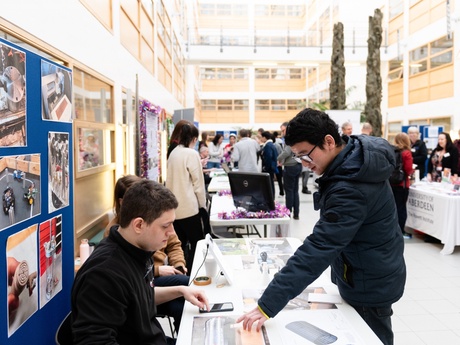 Visitors attending last year's Showcase and engaging with researchers