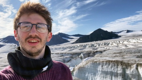 Dr Will Harcourt standing on the Borebreen glacier in Svalbard