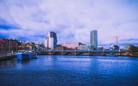 A view of Belfast City Centre, and the iconic Royal Mail building, along the waterfront with the River Lagan