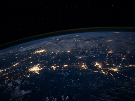 Planet earth at night with energy bright spots in populated areas