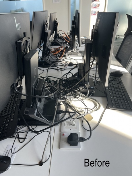 Before image: wires tangled behind monitors