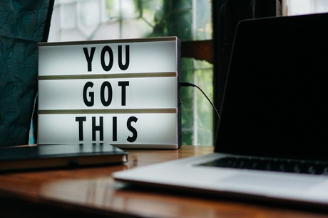 Laptop and lightbox saying 'you got this'