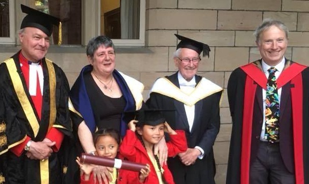 Sheena Blackhall receives her honorary degree. L–R: Very Rev. Sir Iain Torrance (Pro-Chancellor and Elphinstone Institute Patron), Sheena, Robbie Shepherd (Hon. President of the Friends of the Elphinstone Instiute), Thomas McKean (Director of the Elphinstone Institute), Sheena's grandchildren
