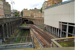 photograph showing the physical interfaces of railway infrastructure, its surrounding environment, and third-party infrastructure, and how they affect and are affected by each other, in the Farringdon area of London