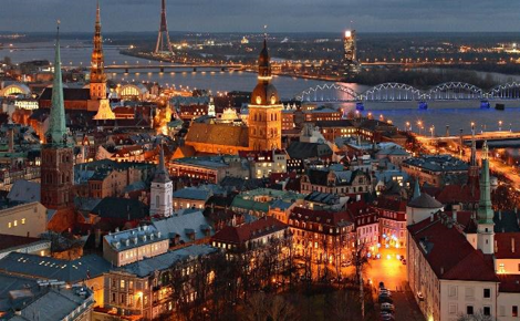 Cityscape of Latvia at night with bright lights