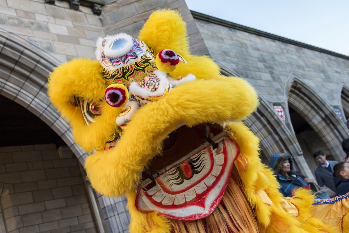 A yellow Chinese lion dancer