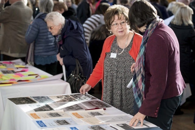 People in hall talking