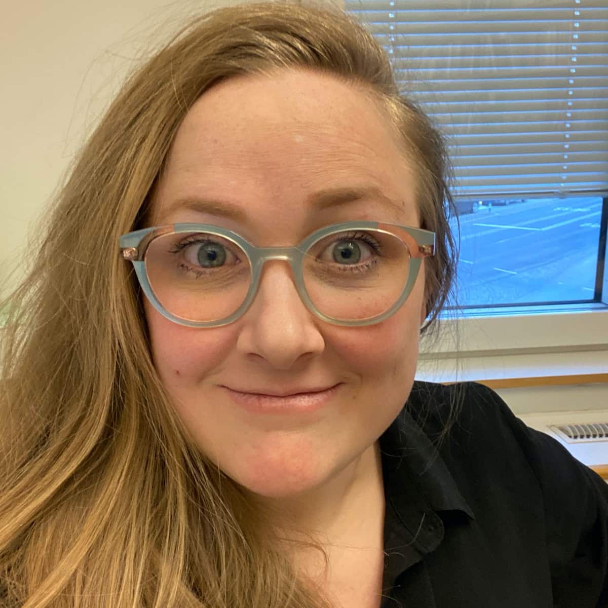 smiling girl with glasses