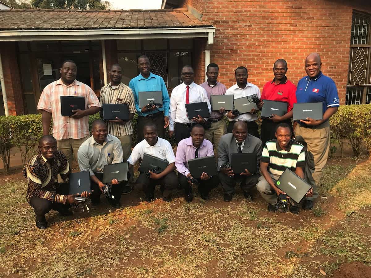 Students with laptops in Malawi