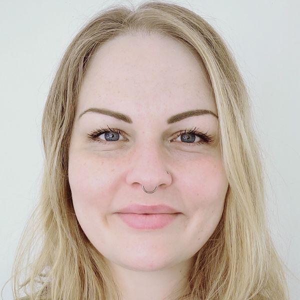 Portrait of Sarah Cairns smiling in front of camera