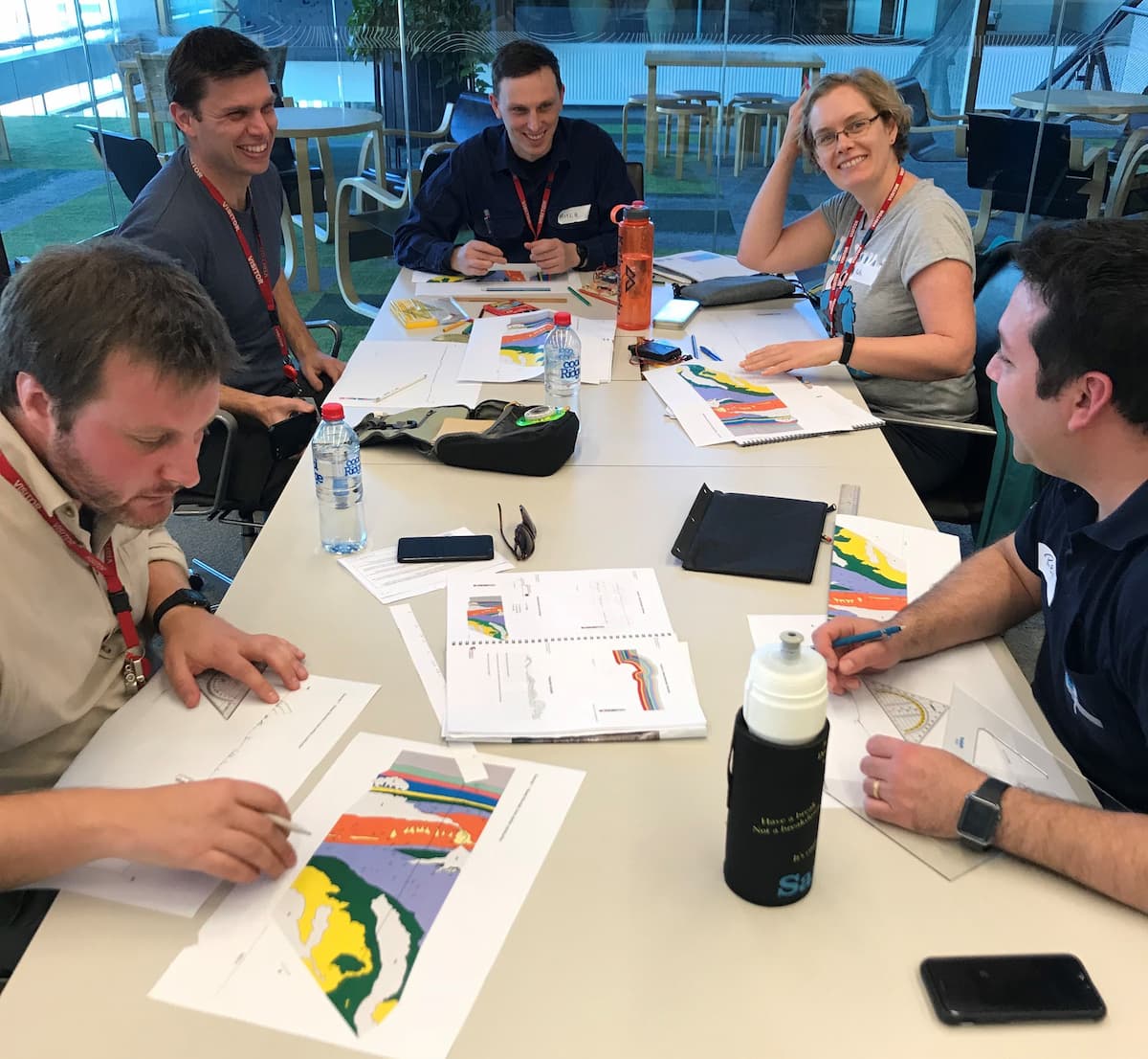 researchers sitting around a desk