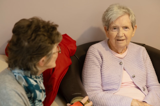 two elderly women chatting