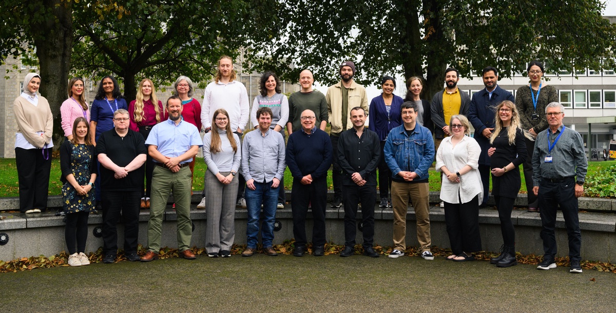 The Epi Group Members line up for their annual photograph outside the Suttie Centre