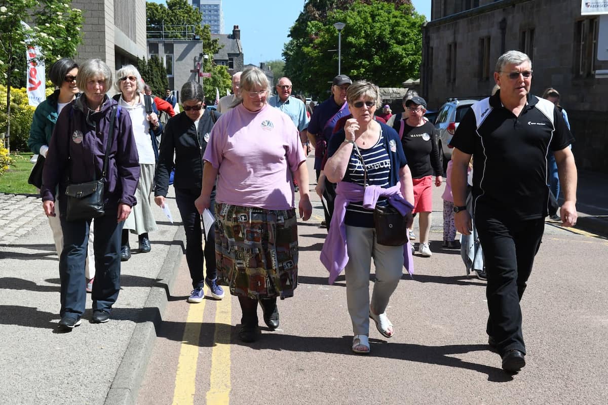 group of elderly people walking