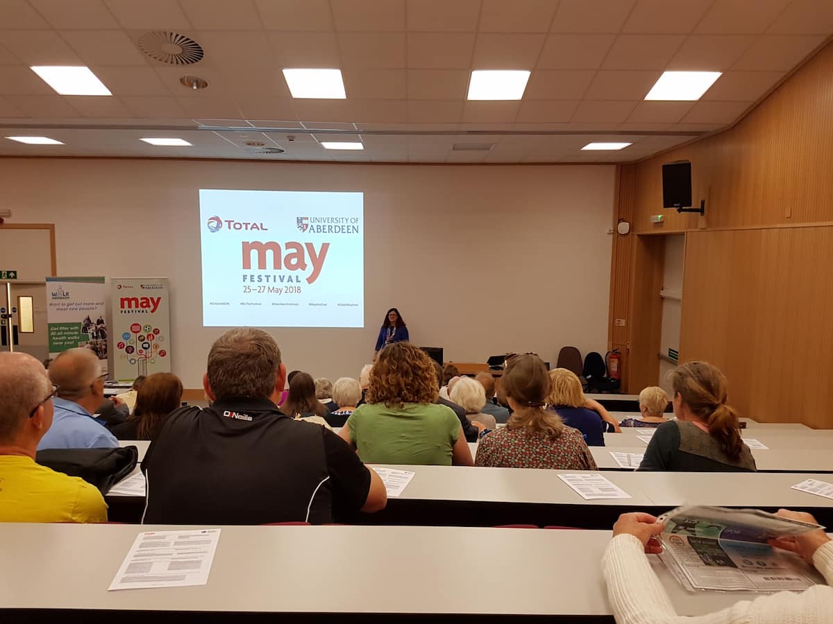 people in talk in lecture theatre