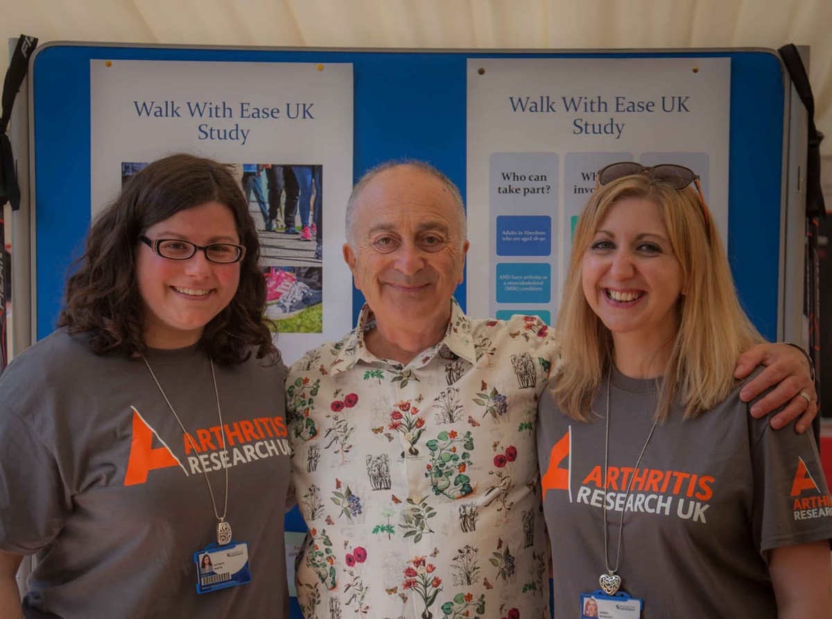 2 arthritis research uk workers with actor Tony Robinson