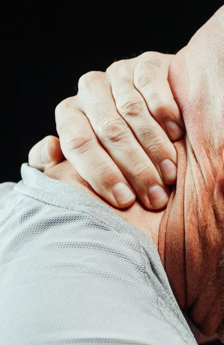 someone holding neck