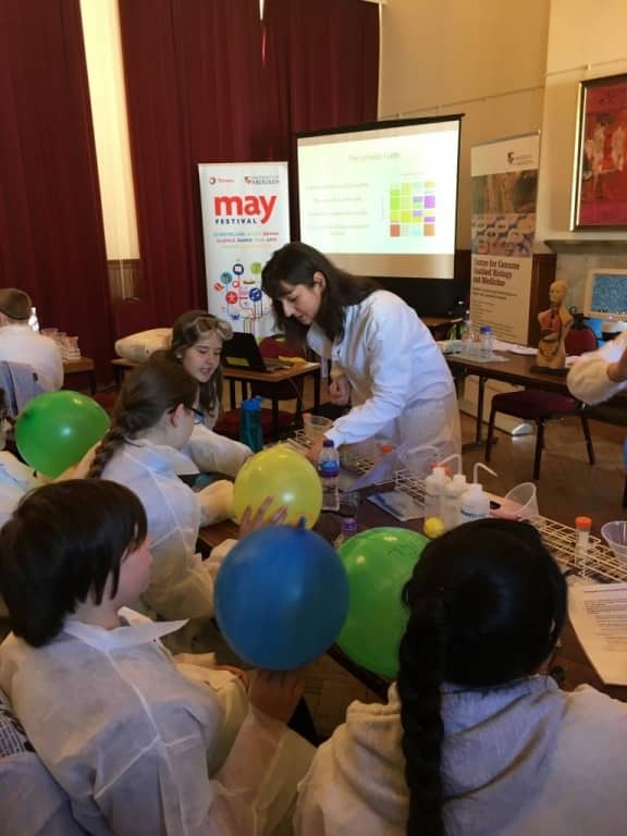school pupils doing science experiment