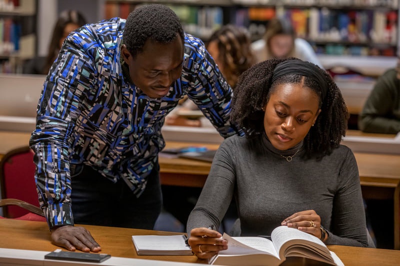 2 students in a library