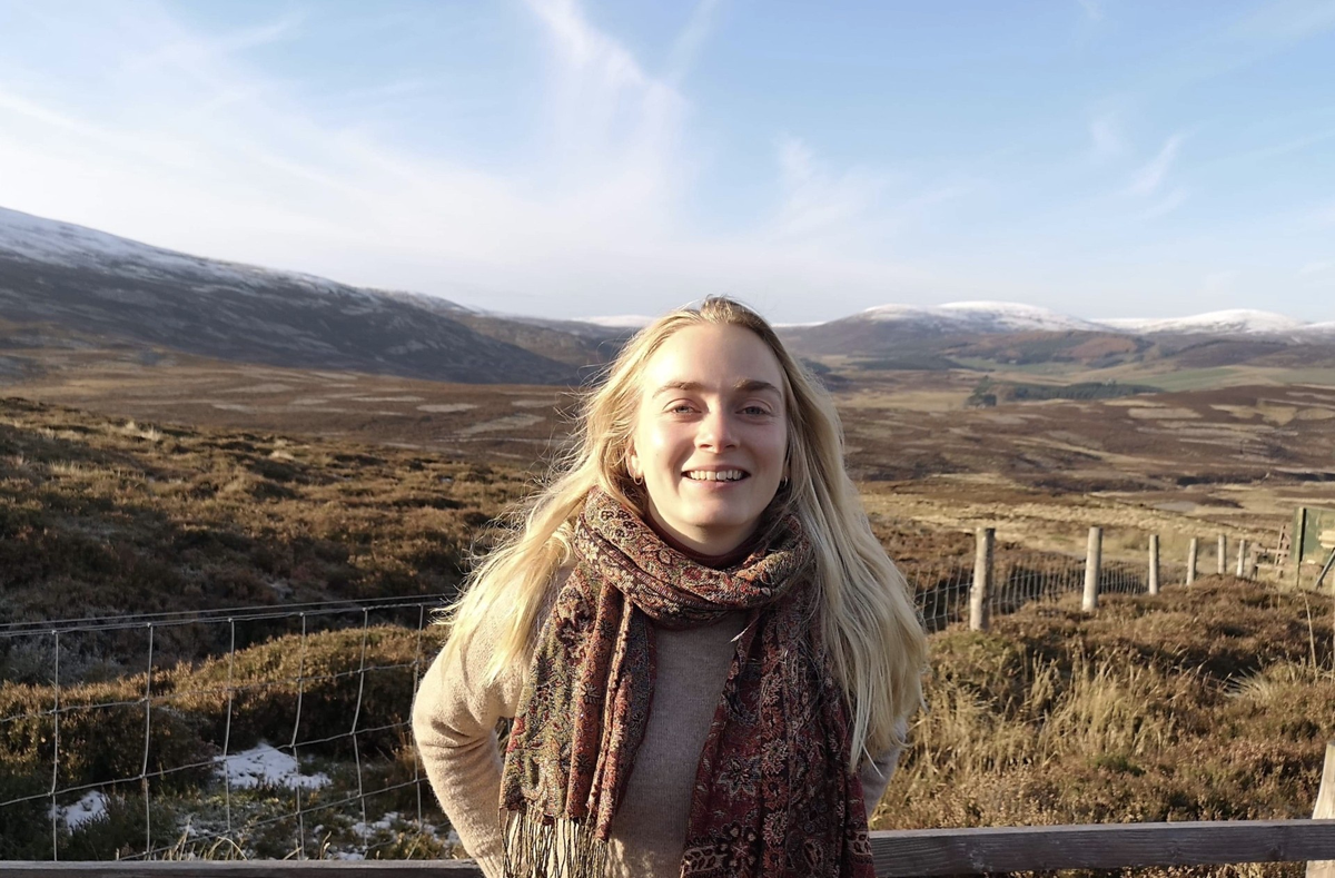 A female with hills in the background