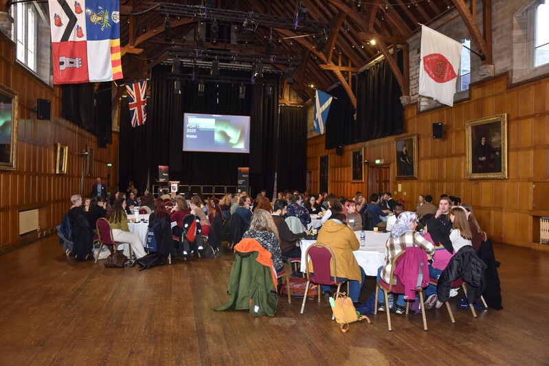 PGR Orientation event hosted in Elphinstone Hall with students sitting on round tables at the start of the event