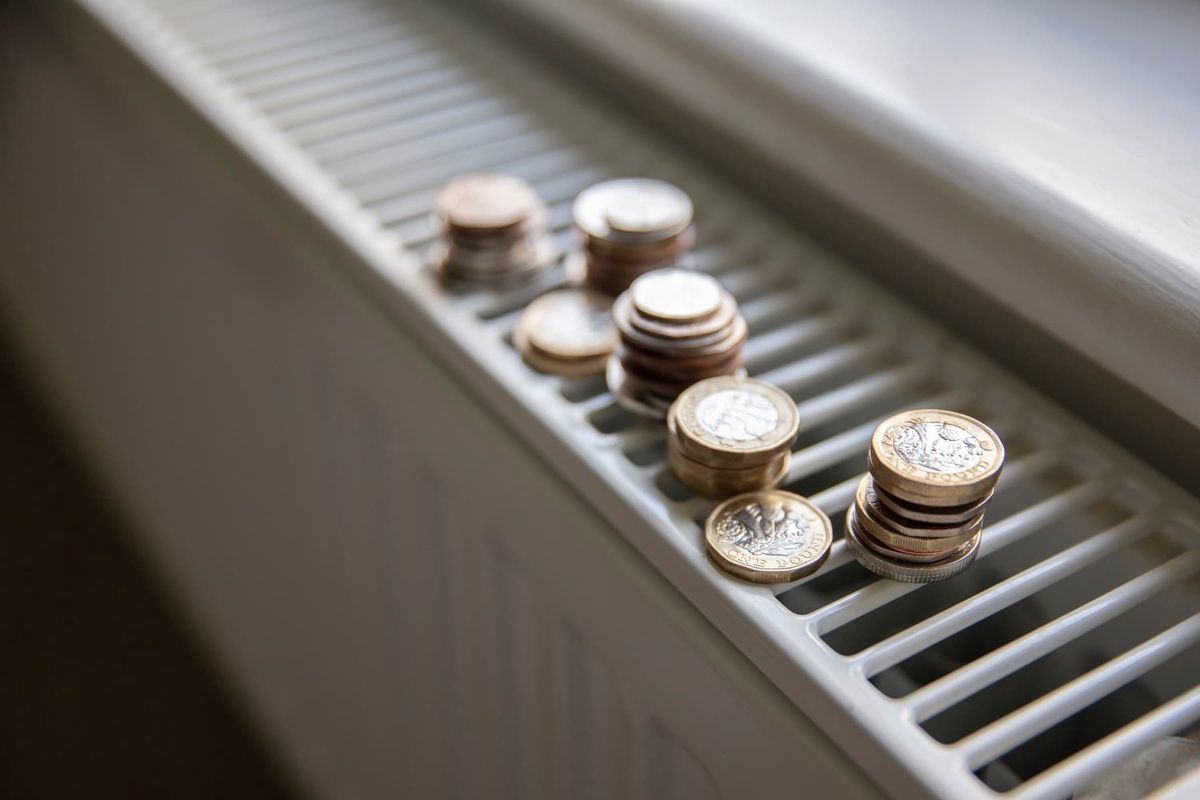 Piles of coins on top of a radiator