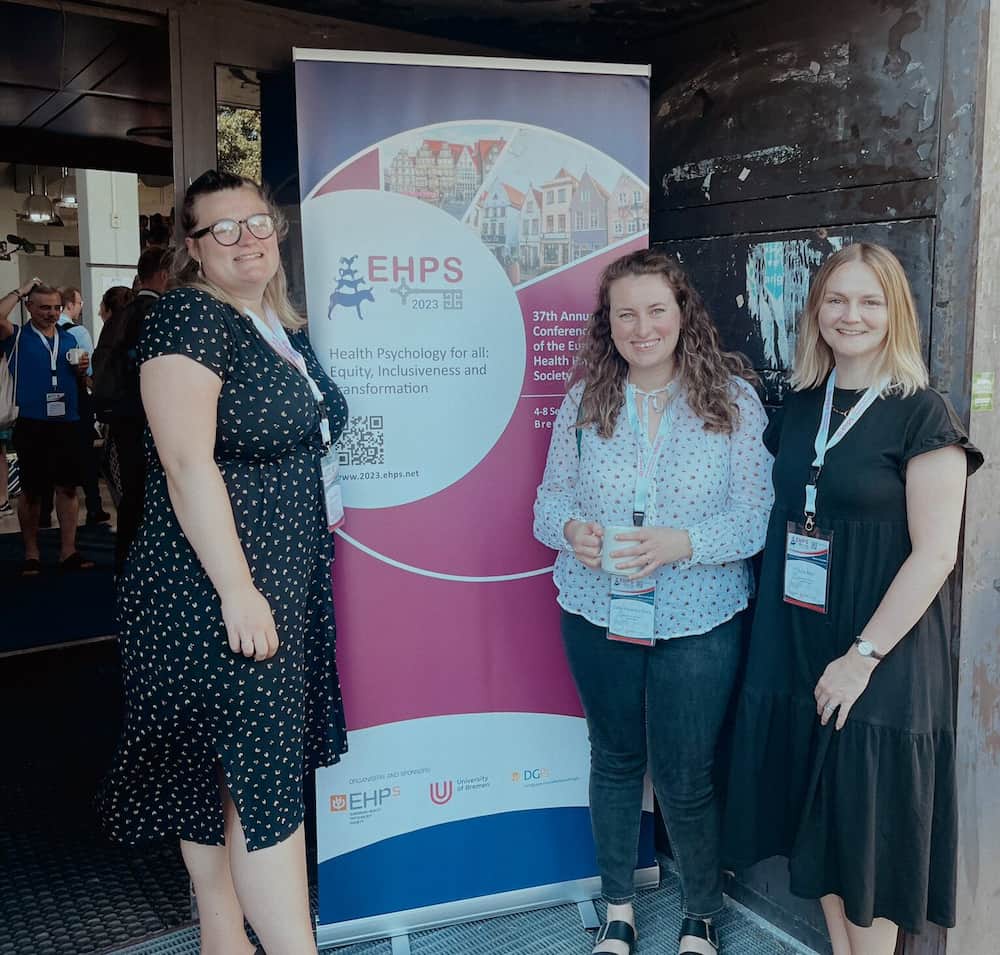 3 women next to an EHPS banner