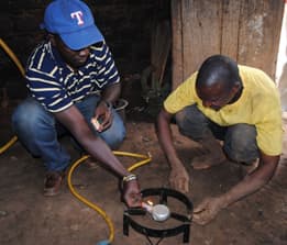 Two men working with equipment