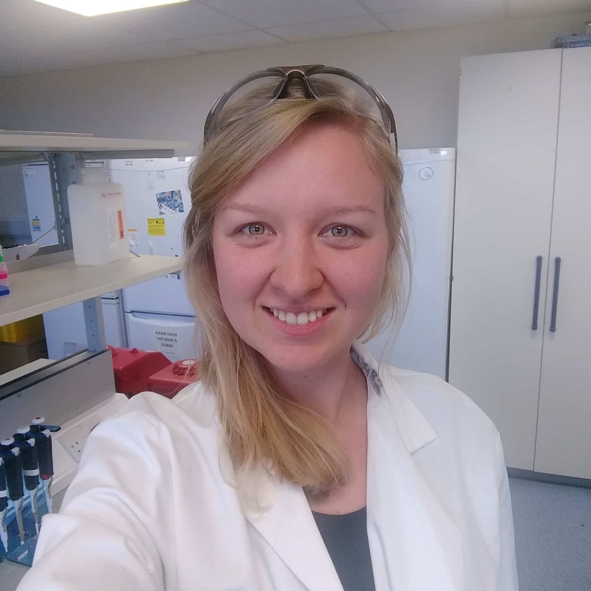smiling woman in lab