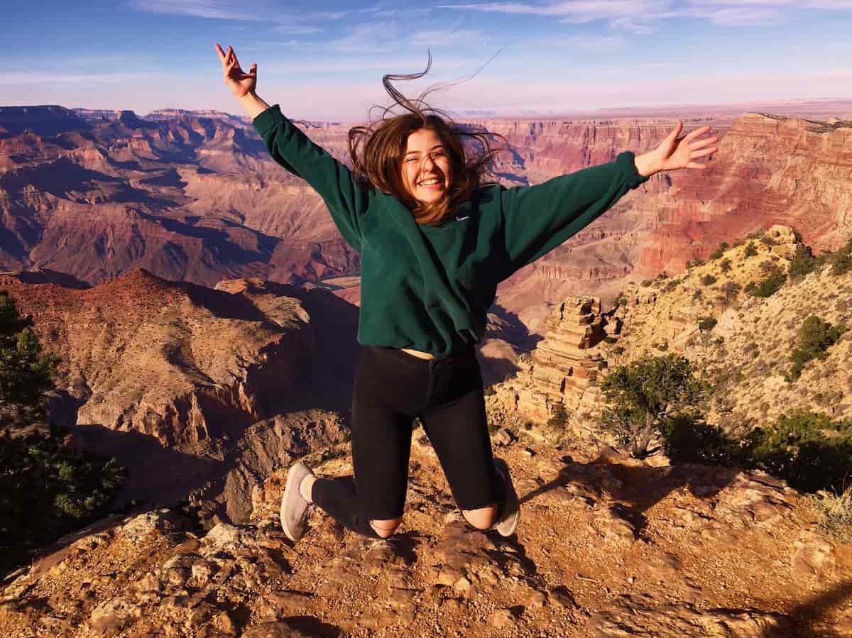 girl up a mountain jumping