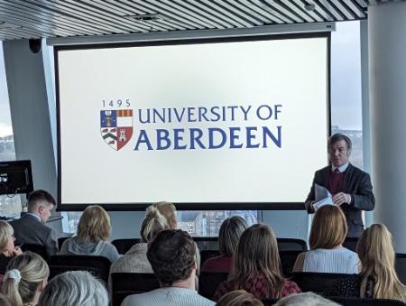 University professor presenting to an audience