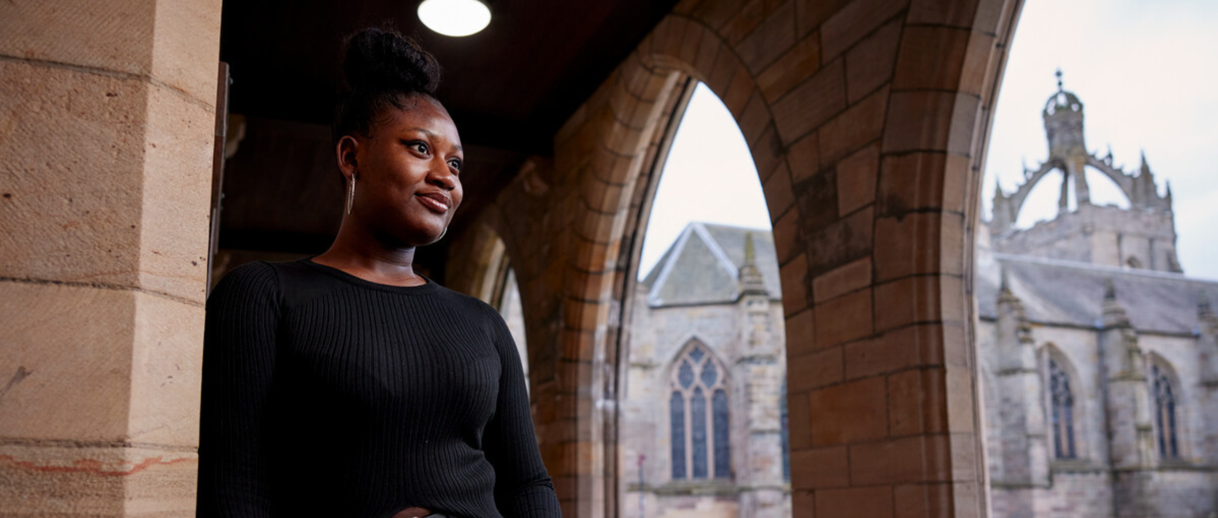 A student with Kings College in the background