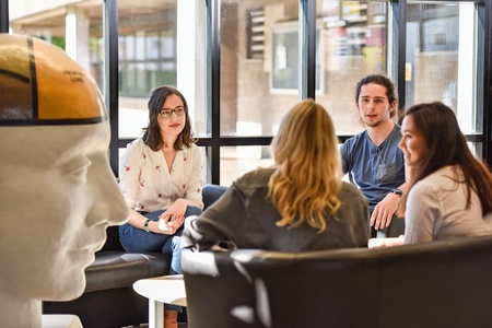 Psychology students sitting around a desk