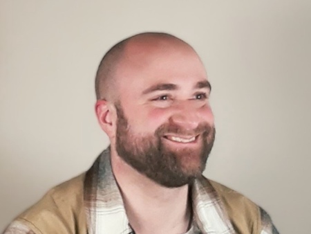 A photo of a man's head and shoulders.