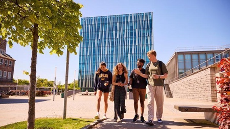 Students walking outside the library