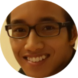 Man with dark hair and glasses