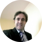 Man with dark hair in suit and tie