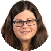 Woman with long dark hair and glasses