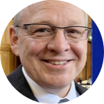 Man wearing glasses and suit and tie