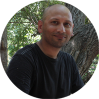 Smiling man with shaved head