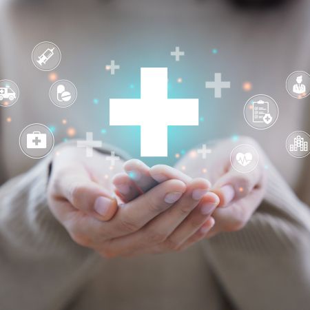 Hands holding symbols related to health science