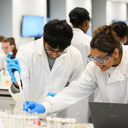 A male and female student in the lab