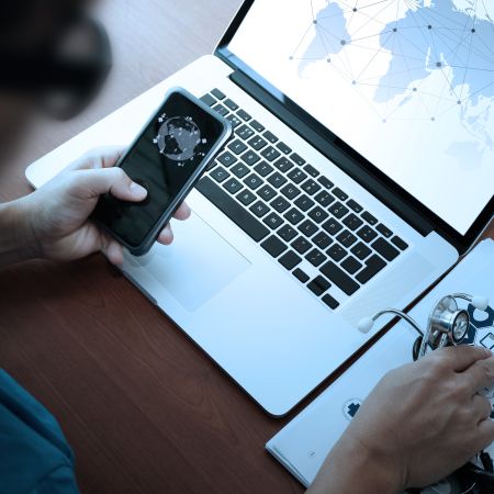 Health data on a laptop and phone