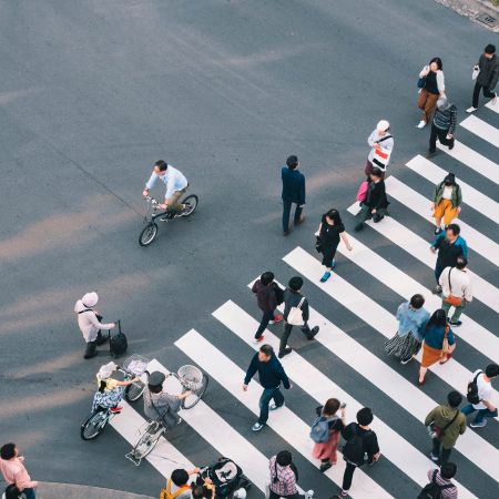 People walking across a road crossing