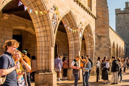 Students standing outside Elphinstone Hall at event
