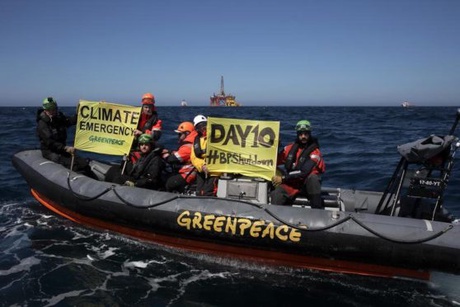 Greenpeace protestors in the North Sea with Paul B Loyd Jr in the background