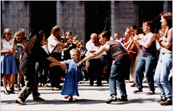 Dancers and fiddle players outside