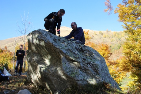Researchers collecting rock samples