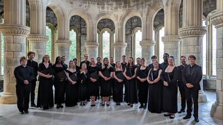 The Chamber Choir assembled in front of ornate architecture