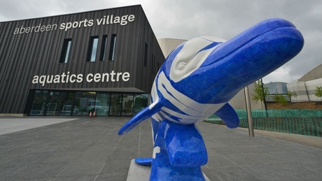Swimmers of the World can be seen outside the Aquatics Centre